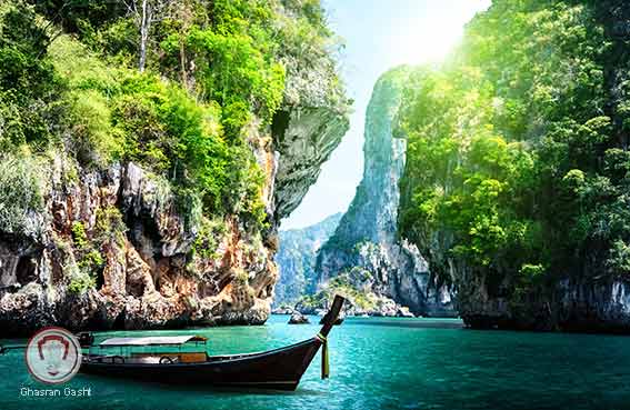 long boat and rocks on railay beach in Krabi Thailand shutterstock 125319602 2